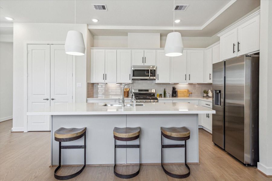 Representative photo showing the community’s model home kitchen. Layout and selections may vary.
