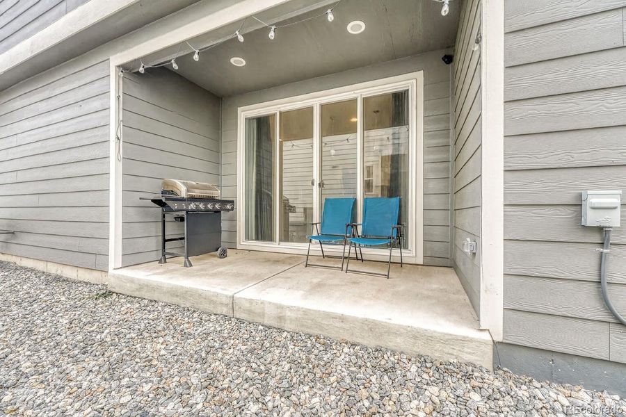 Exterior details and patio area of a home in Urban Collection at Copperleaf, Aurora (Image 18).