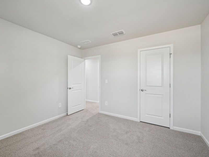 Spacious, unfurnished interior of a new home in River Glen, Angier (Image 25).