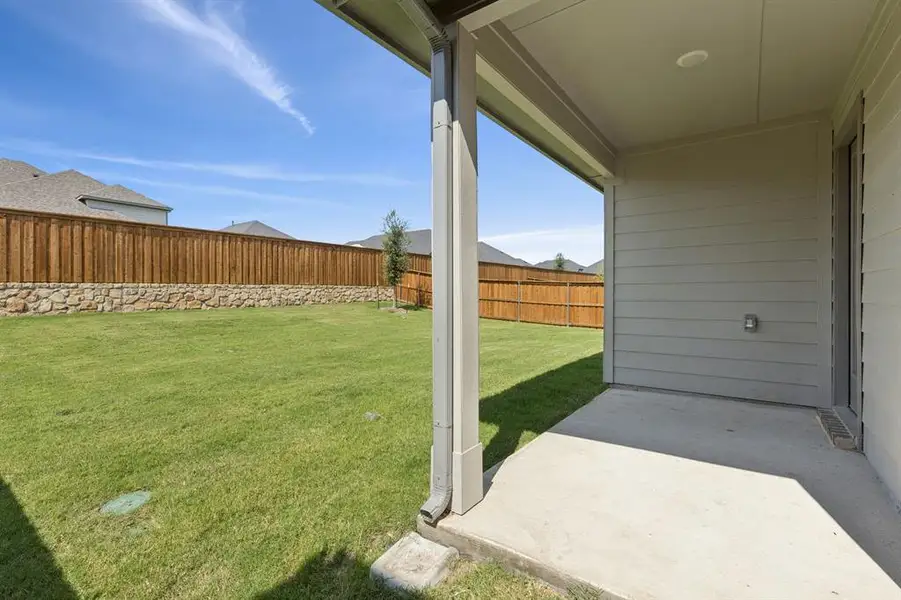 Covered Patio in the Heisman home plan by Trophy Signature Homes – REPRESENTATIVE PHOTO