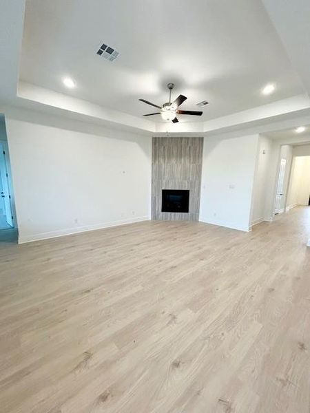 Family Room with tray ceiling & fireplace