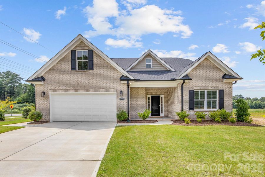 Front exterior of a new home in , Waxhaw, NC, highlighting curb appeal (Image 25). Front exterior of a new home in , Waxhaw, NC, highlighting curb appeal (Image 25).
