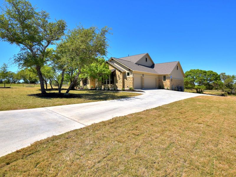 Representative exterior photo of a completed home built from the San Simeon I by Giddens Homes in Clearwater Ranch, Liberty Hill, TX (Image 32).
