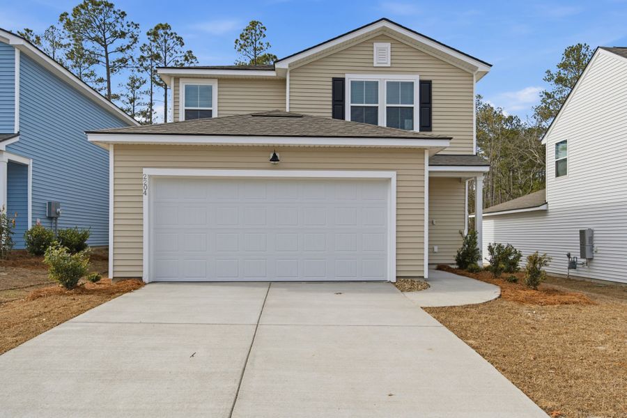 Front exterior of a new home in Grand Arbor, Blythewood, SC, highlighting curb appeal (Image 1). Front exterior of a new home in Grand Arbor, Blythewood, SC, highlighting curb appeal (Image 1).