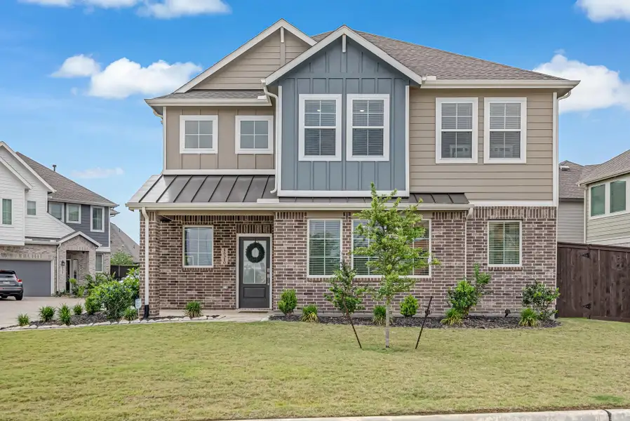 Front exterior of a new home in The Groves, Humble, TX, highlighting curb appeal (Image 21).