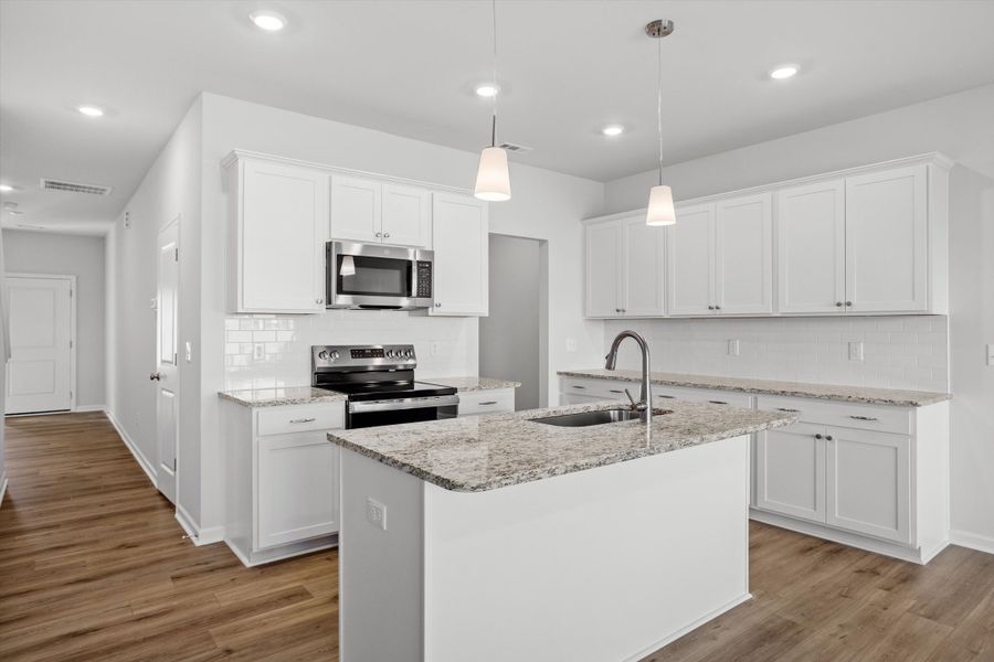 Furnished interior view inside a new home in West Main Townhomes, Sanford (Image 5).