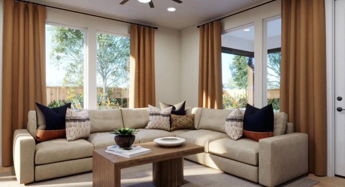 Living room with ceiling fan, healthy amount of natural light, and recessed lighting