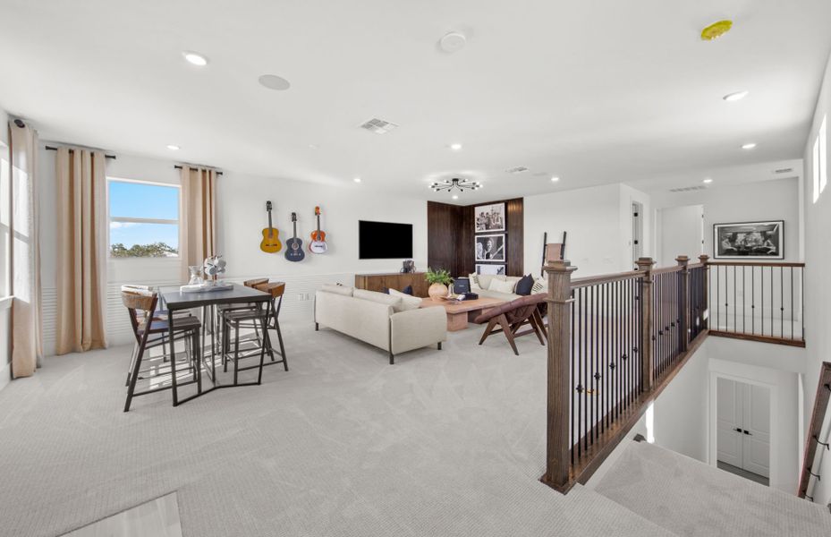 Representative furnished interior of a home built from the Layton Grande by DiVosta in BeachWalk by Manasota Key, Englewood (Image 19).