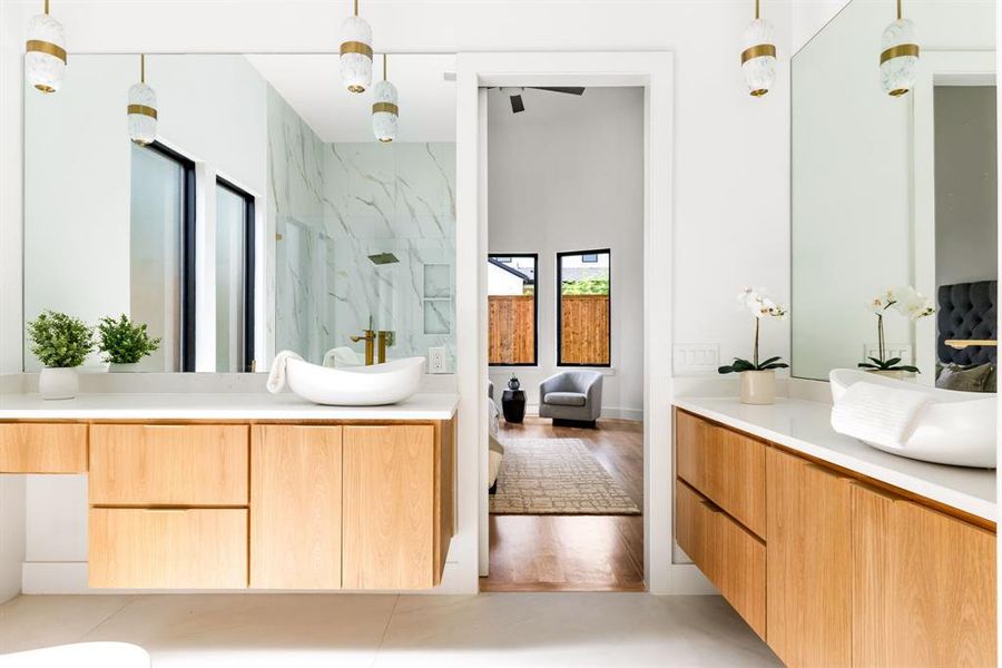 Bathroom featuring a marble finish shower and vanity Bathroom featuring a marble finish shower and vanity