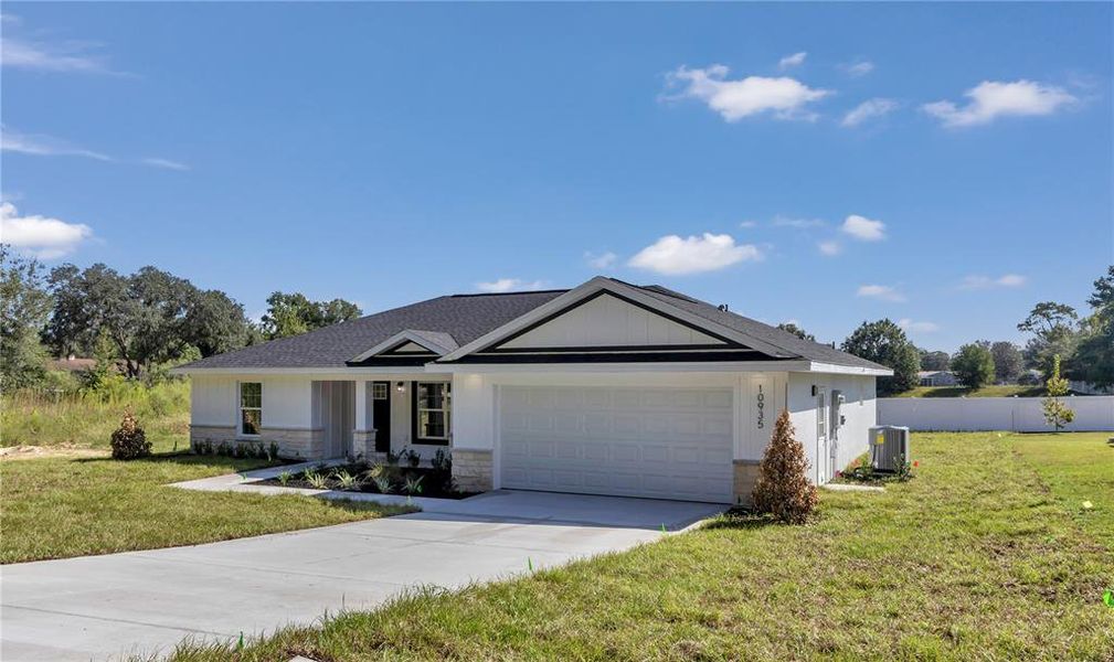 Front exterior of a new home in , Ocala, FL, highlighting curb appeal (Image 1).
