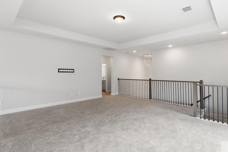 Designed with versatility in mind, this spacious upstairs retreat offers ample room for movie nights, game tables, a home office, or a secondary family room. The open layout adapts effortlessly to your lifestyle.