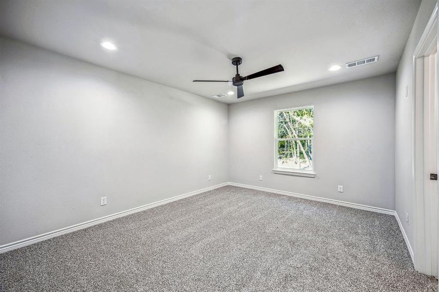 Master bedroom with attached bath and walk in closet.