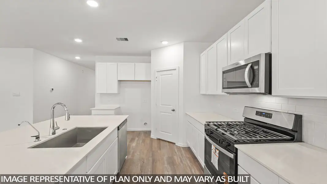 Furnished interior view inside a new home in Sunterra, Katy (Image 7).