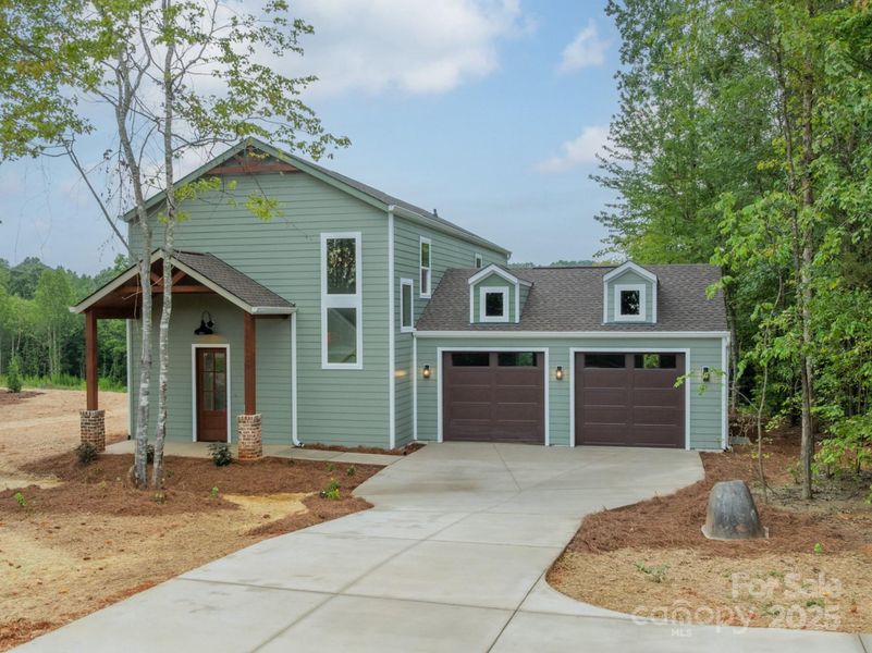 Front exterior of a new home in , Catawba, NC, highlighting curb appeal (Image 1).