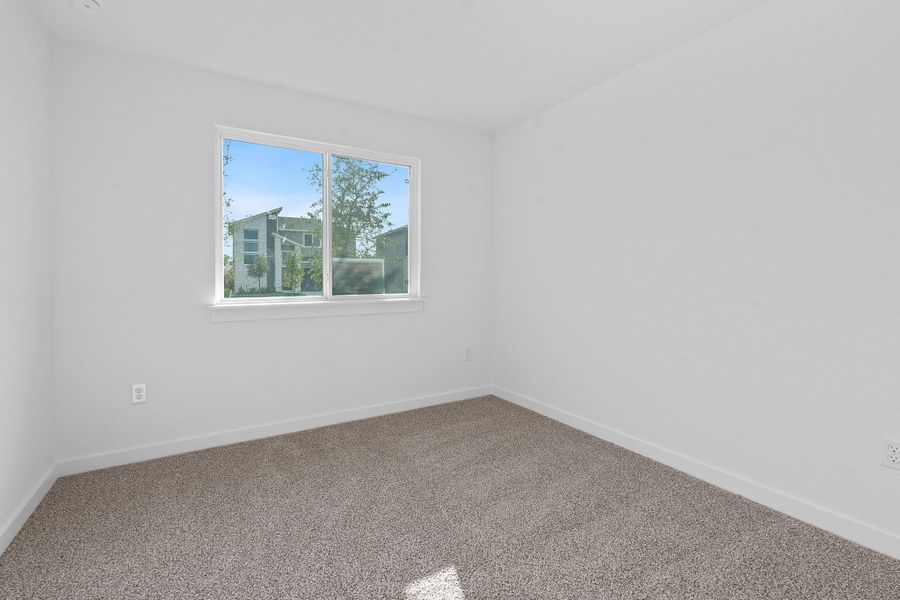 Unfurnished room with baseboards and carpet flooring
