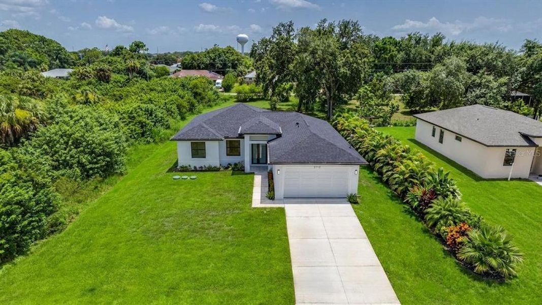 Front exterior of a new home in , Lehigh Acres, FL, highlighting curb appeal (Image 1). Front exterior of a new home in , Lehigh Acres, FL, highlighting curb appeal (Image 1).