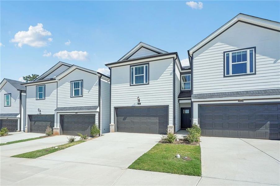 Front exterior of a new home in , Conyers, GA, highlighting curb appeal (Image 19). Front exterior of a new home in , Conyers, GA, highlighting curb appeal (Image 19).
