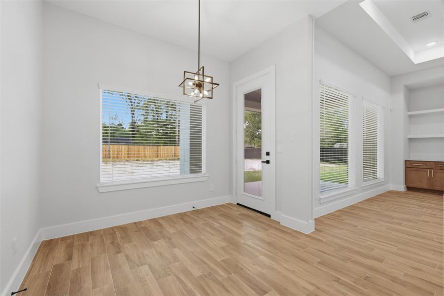 Not only do you have the formal dining room at the entry, you get an every day breakfast room right off the kitchen overlooking your massive backyard! And you'll still be able to see the TV while you eat!