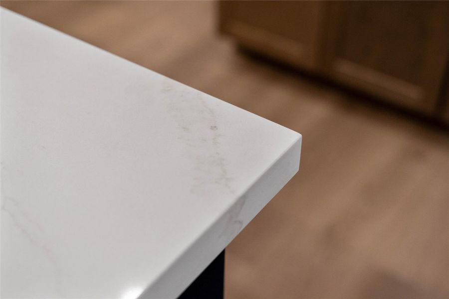 Kitchen countertops - Calacatta Eyliso Quartz - a clean, modern edge profile.