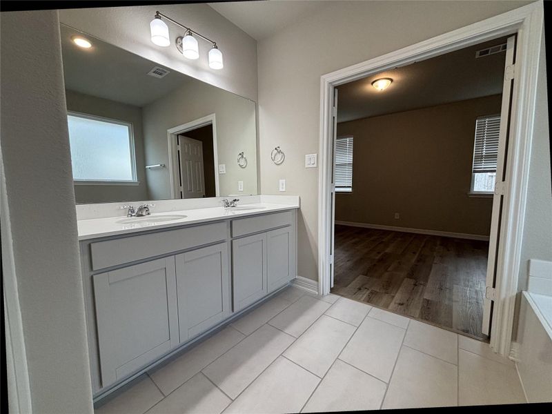Furnished interior view inside a new home in Sunterra, Katy (Image 8).