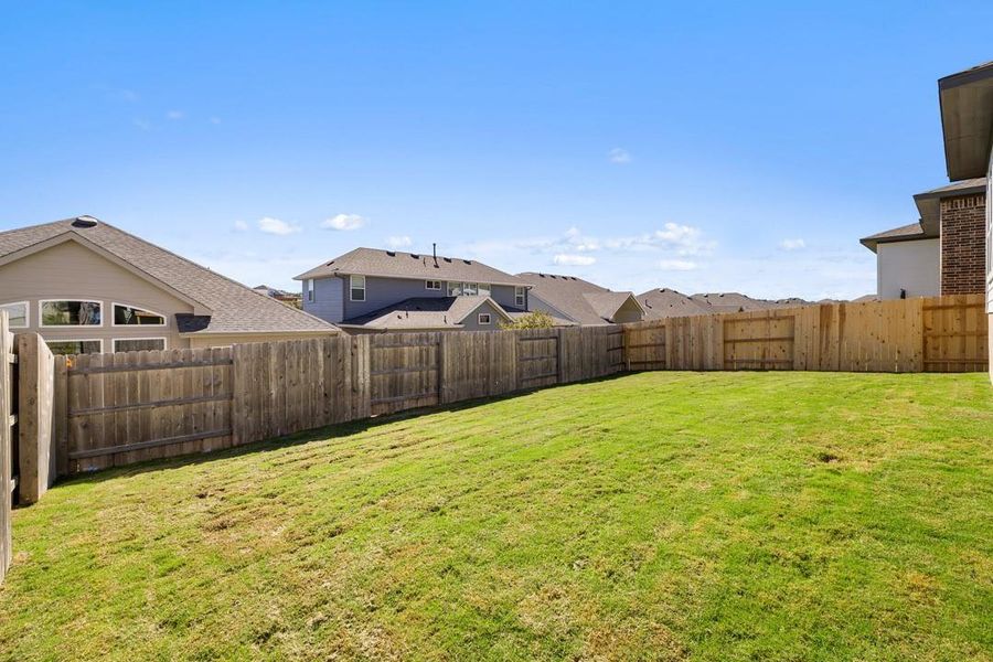 Exterior details and patio area of a home in Lariat, Liberty Hill (Image 25).