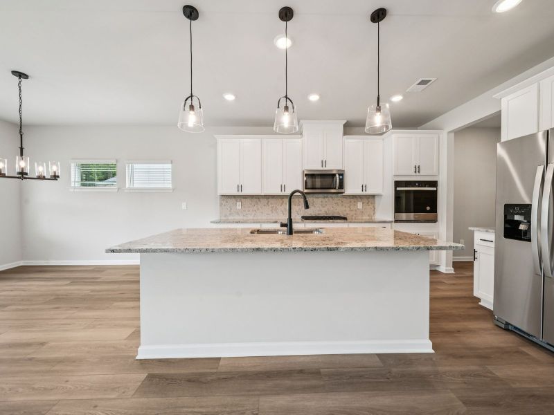 Furnished interior view inside a new home in Vines at Mill Creek - Estate Series, Braselton (Image 5).