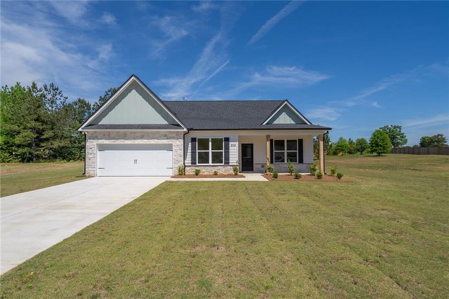 Front exterior of a new home in , Good Hope, GA, highlighting curb appeal (Image 2). Front exterior of a new home in , Good Hope, GA, highlighting curb appeal (Image 2).