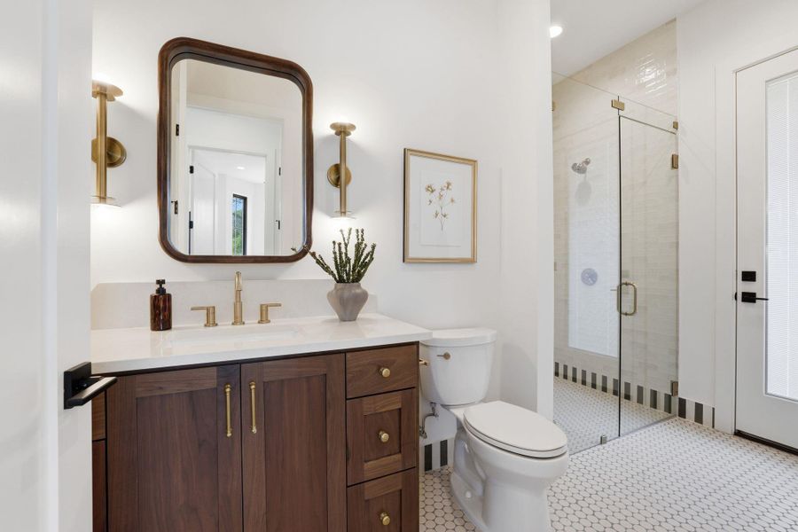 Bathroom with vanity and a stall shower