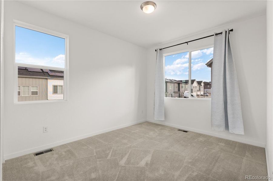 Spacious, unfurnished interior of a new home in Whisper Village, Arvada (Image 24).