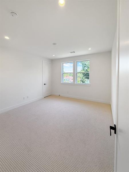 Spare room with recessed lighting and light carpet Spare room with recessed lighting and light carpet