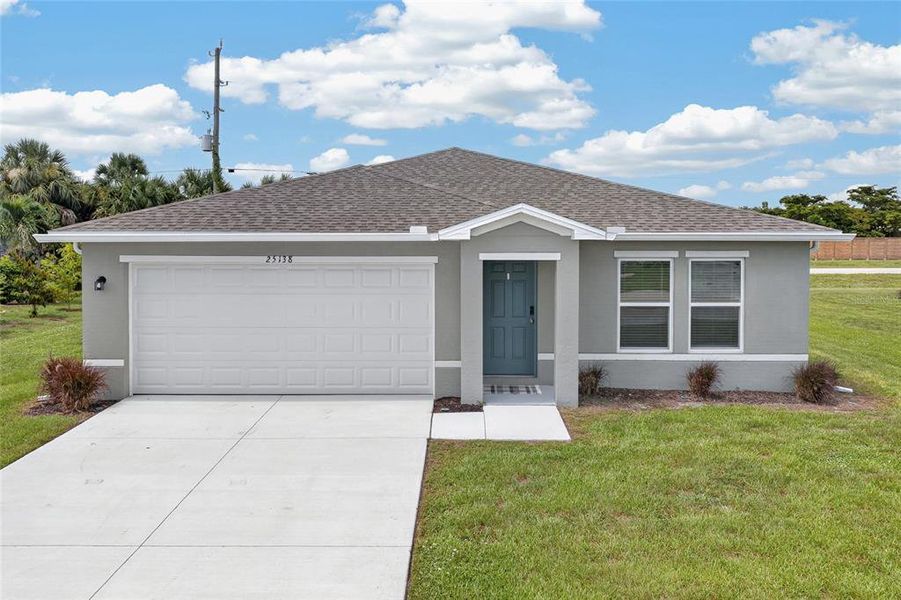 Front exterior of a new home in , Punta Gorda, FL, highlighting curb appeal (Image 2). Front exterior of a new home in , Punta Gorda, FL, highlighting curb appeal (Image 2).