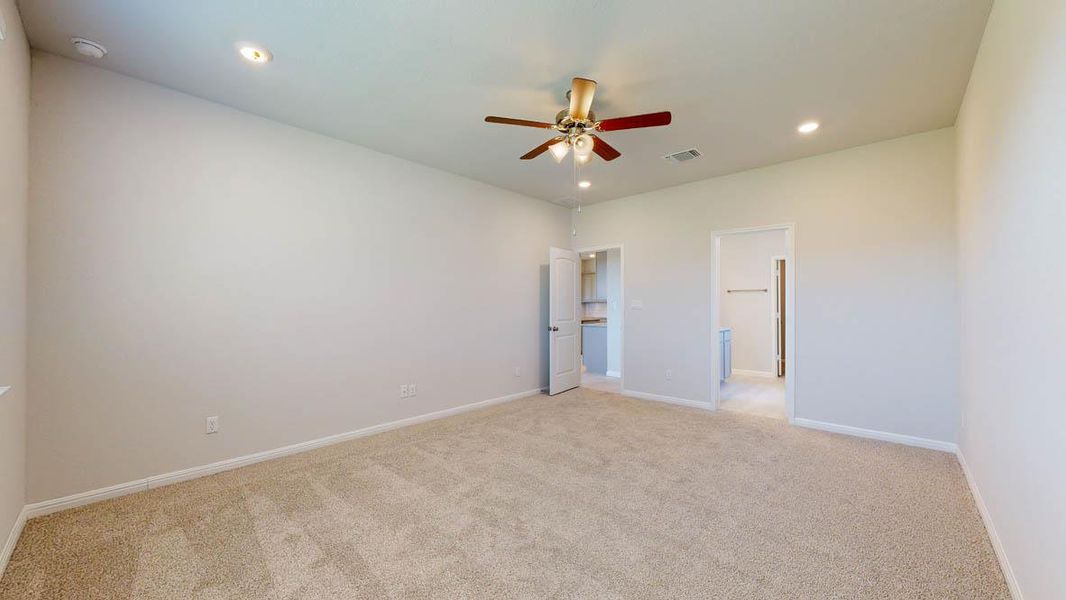 Unfurnished bedroom with light carpet, a ceiling fan, and recessed lighting