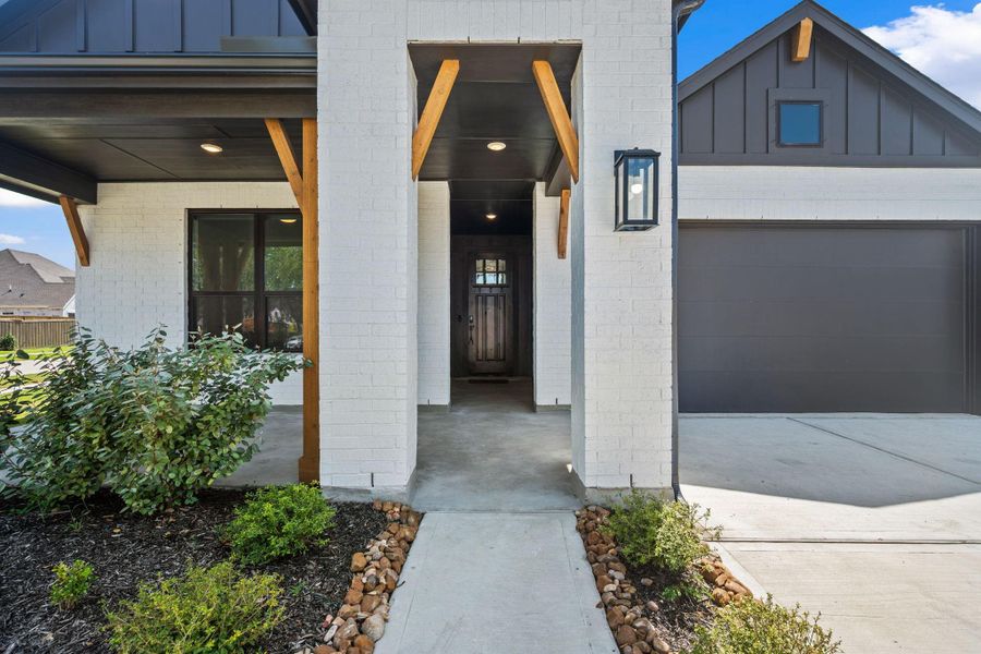 Front exterior of a new home in Riceland: 50ft. lots, Mont Belvieu, TX, highlighting curb appeal (Image 21). Front exterior of a new home in Riceland: 50ft. lots, Mont Belvieu, TX, highlighting curb appeal (Image 21).
