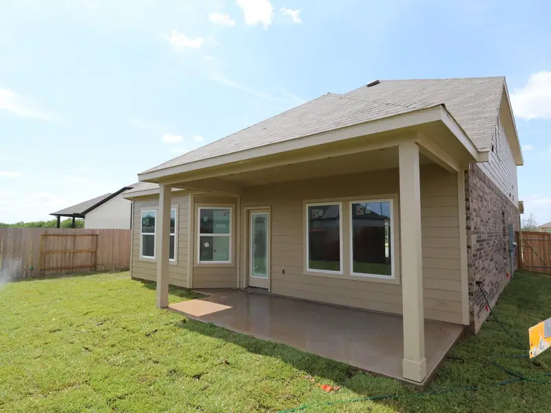 Front exterior of a new home in Miller's Pond, Rosenberg, TX, highlighting curb appeal (Image 2). Front exterior of a new home in Miller's Pond, Rosenberg, TX, highlighting curb appeal (Image 2).