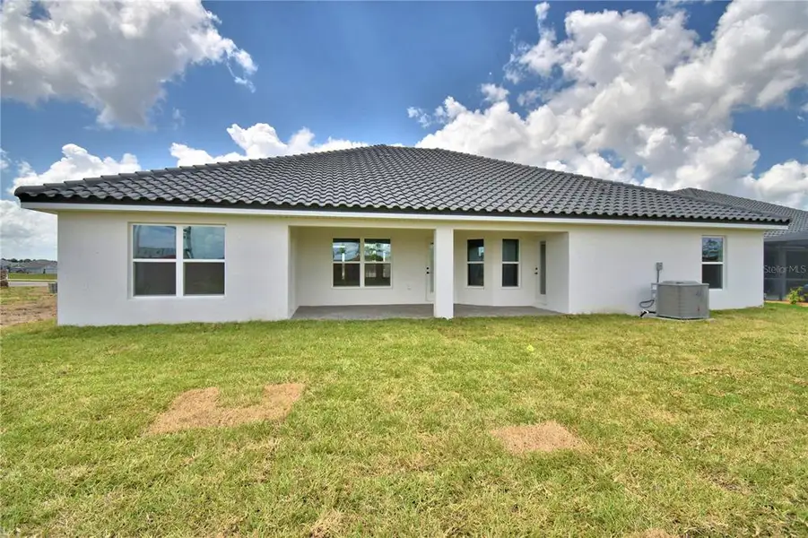 Exterior details and patio area of a home in Lake Juliana Estates, Auburndale (Image 3).