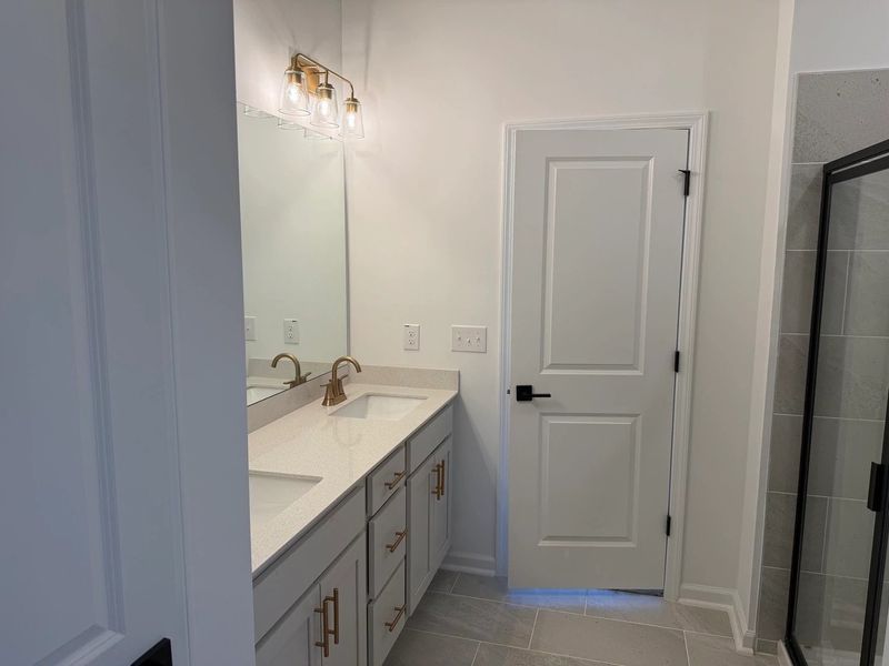 Primary Bath featuring the AW Collection® Serene - Clean forms offer quiet luxury. Primary Bath featuring the AW Collection® Serene - Clean forms offer quiet luxury.