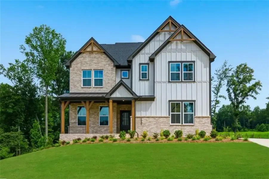 Front exterior of a new home in Acacia, Cumming, GA, highlighting curb appeal (Image 19). Front exterior of a new home in Acacia, Cumming, GA, highlighting curb appeal (Image 19).
