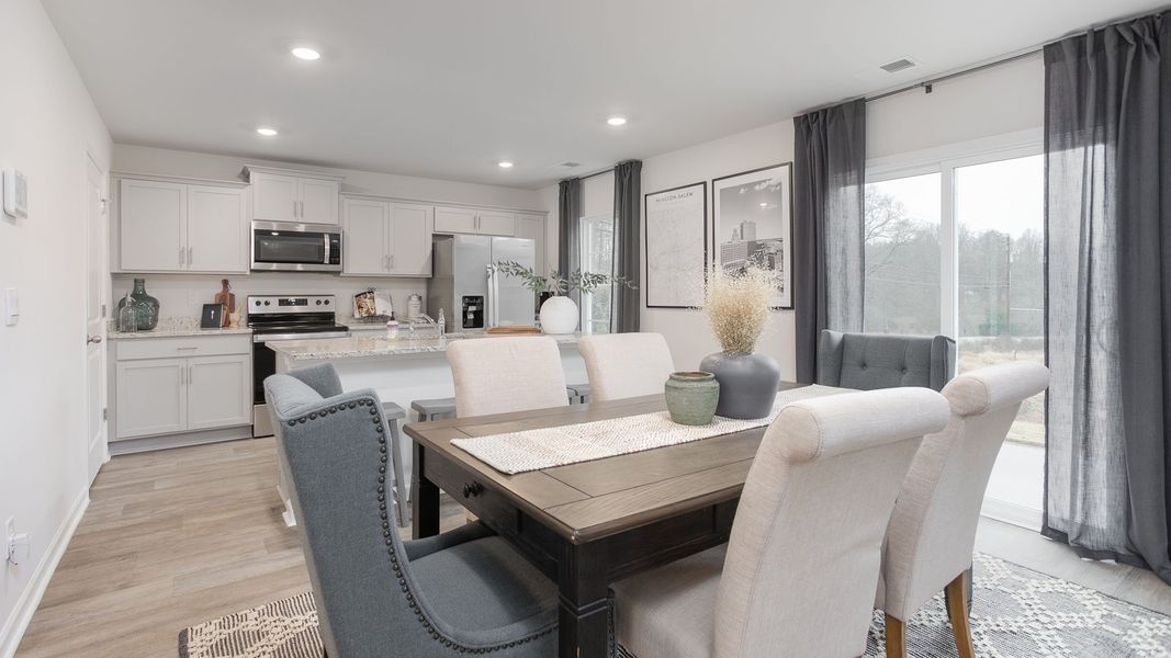Representative furnished interior of a home built from the PENWELL by D.R. Horton in Preston Oaks, King (Image 8).