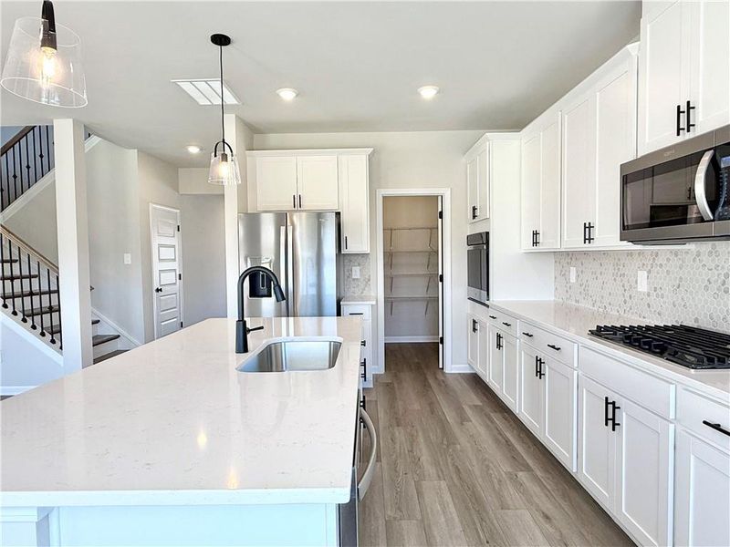 Furnished interior view inside a new home in Vines at Mill Creek - Estate Series, Braselton (Image 6). Furnished interior view inside a new home in Vines at Mill Creek - Estate Series, Braselton (Image 6).