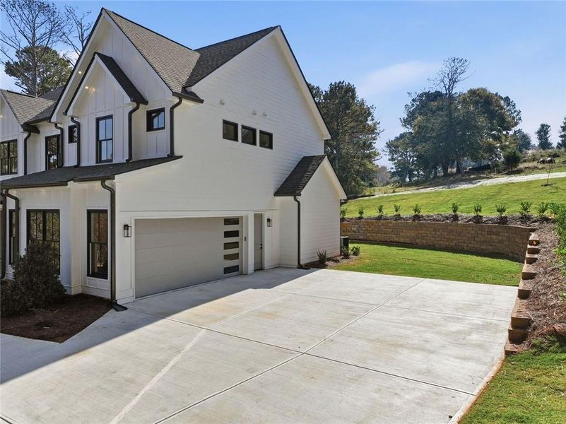 Front exterior of a new home in , Monroe, GA, highlighting curb appeal (Image 23).