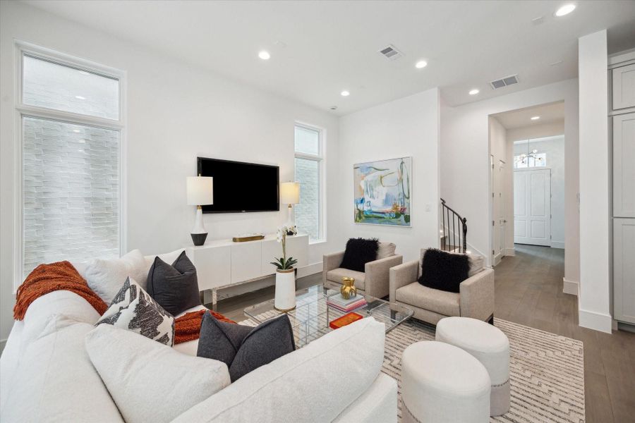 The stunning first floor was designed with relaxation and entertaining in mind! Spacious enough for ample seating, a large dining table, and an island with additional seating that overlooks the living space. The stunning first floor was designed with relaxation and entertaining in mind! Spacious enough for ample seating, a large dining table, and an island with additional seating that overlooks the living space.