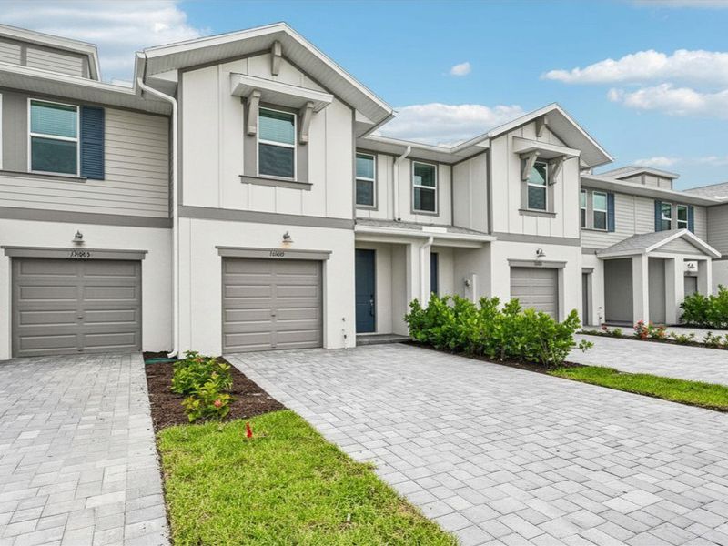 Front exterior of a new home in Meritage Homes at Central Park, Port St. Lucie, FL, highlighting curb appeal (Image 2). Front exterior of a new home in Meritage Homes at Central Park, Port St. Lucie, FL, highlighting curb appeal (Image 2).