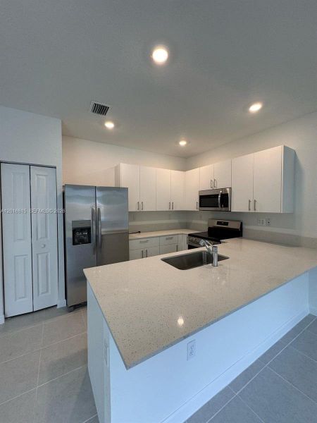 Furnished interior view inside a new home in , Homestead (Image 11). Furnished interior view inside a new home in , Homestead (Image 11).
