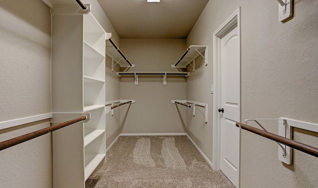 Spacious owner's walk-in closet