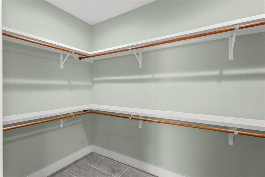 View of spacious closet in primary bathroom
