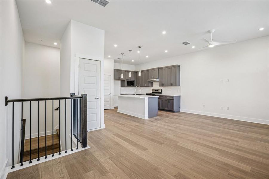 Upstairs the living, dining, andkitchen that’s all about light,space, and flow. (Sample photoof finishes and layout)