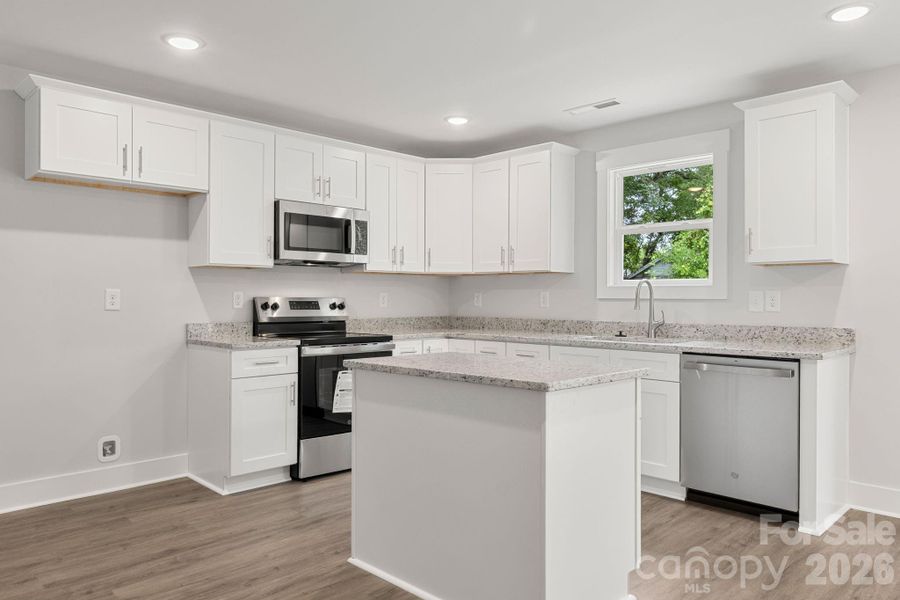 Wood cabinets w/granite