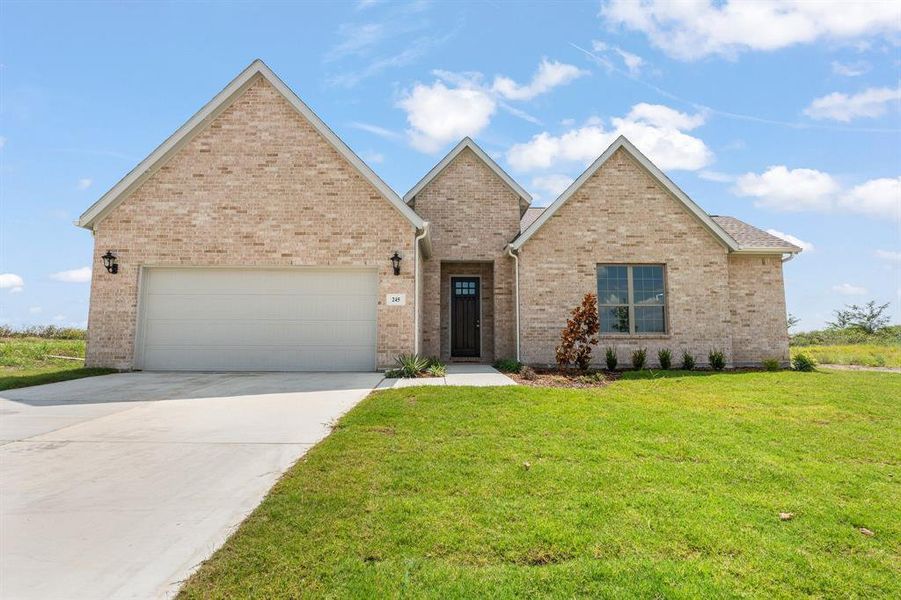 Front exterior of a new home in , Venus, TX, highlighting curb appeal (Image 32). Front exterior of a new home in , Venus, TX, highlighting curb appeal (Image 32).