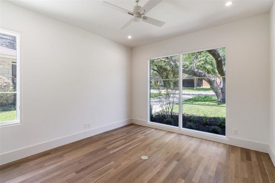 Empty room with light wood-style floors, recessed lighting, and a ceiling fan Empty room with light wood-style floors, recessed lighting, and a ceiling fan