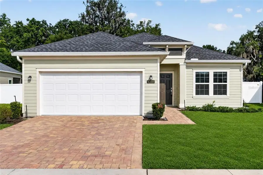 Front exterior of a new home in Heath Preserve, Ocala, FL, highlighting curb appeal (Image 21).